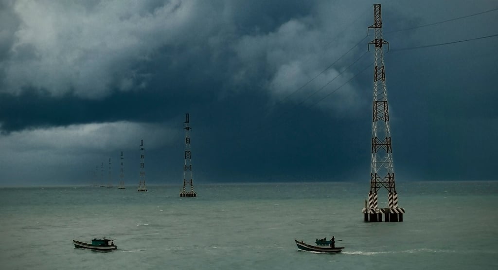 Electricity pylons crossing the ocean. Hon Son, Vietnam
