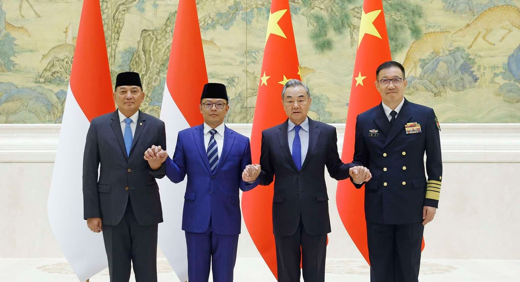 a group of men standing next to each other