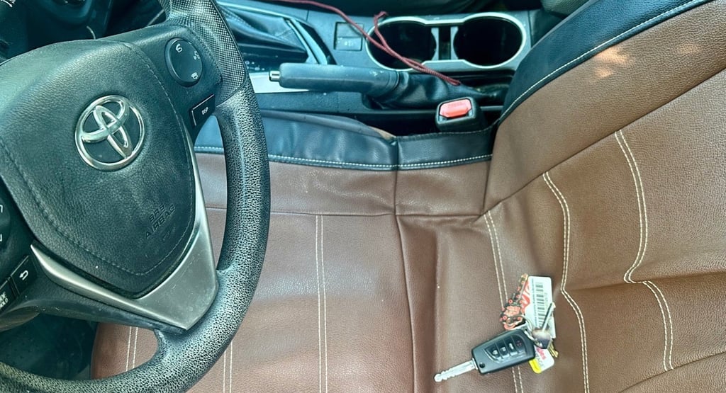 Car key locked inside of vehicle on seat—  representing emergency locksmith by Asheville Locksmith Now 