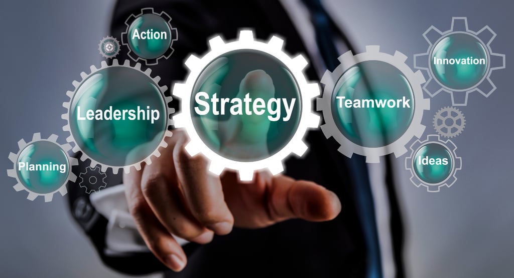 a man in a suit and tie pointing to a gear image with the word strategy.