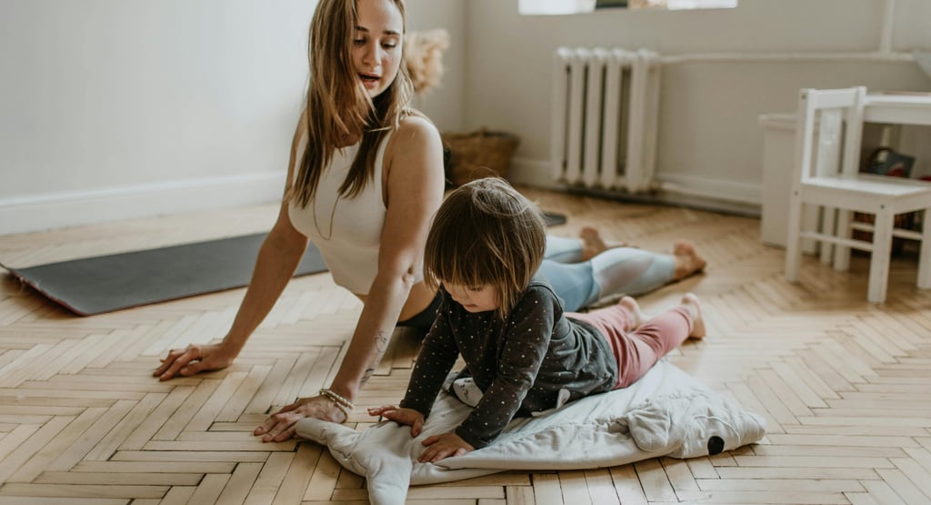 a woman and her daughter playing with a pillow