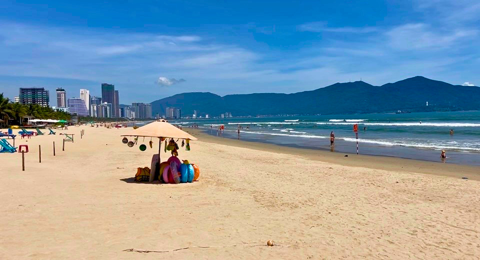 My Khe Beach Da Nang with swimmers and coastal buildings
