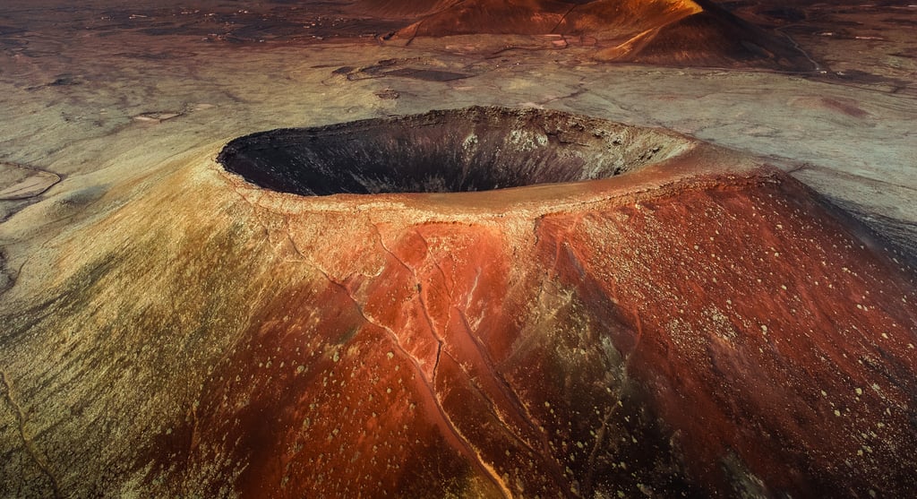a volcano  with a volcano in the background