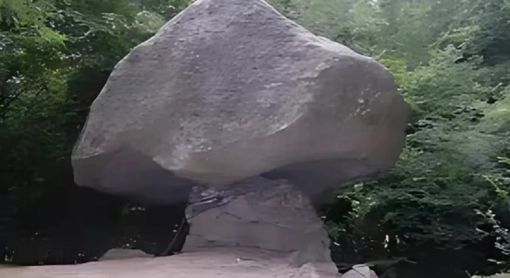 ietra Pendula boulder balancing on rock stem near Torno, Lake Como