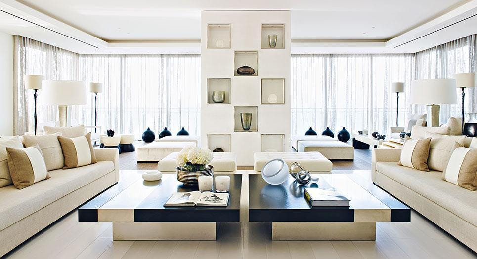 a living room with a couch and a table Nour Nagy Designs London interior Design