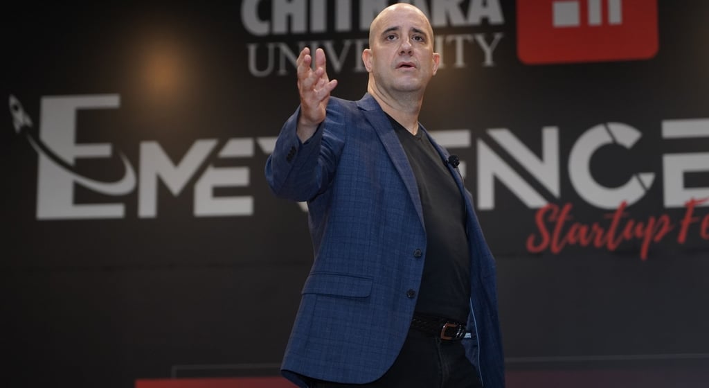 Ashwin Mushran speaking on stage