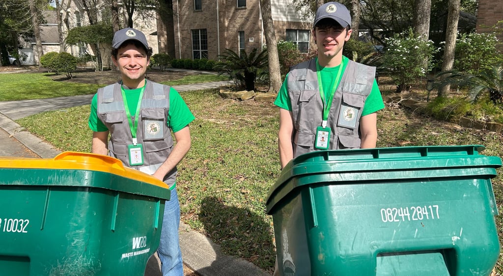 Trash Can Caddie team rolling bins to the curb