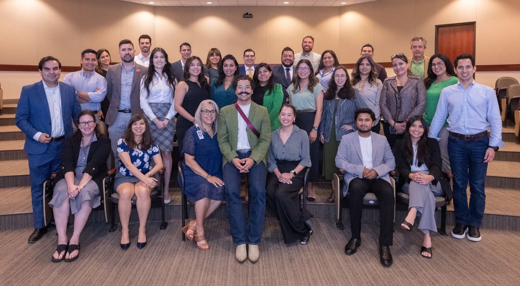 Francisco stands proudly with Hispanic Austin Leadership classmates, gathered for a group photo