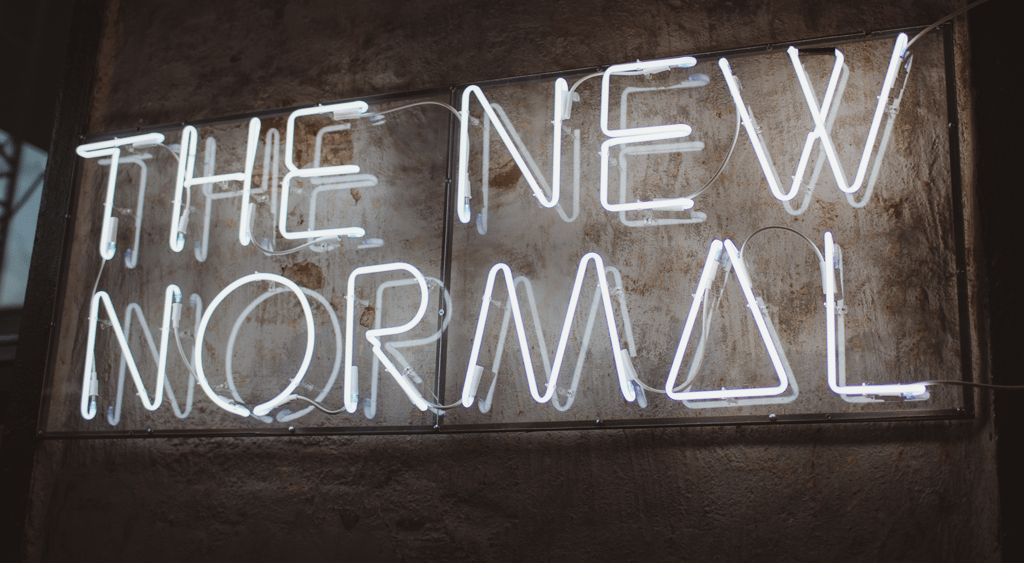 photo of neon sign saying The New Normal