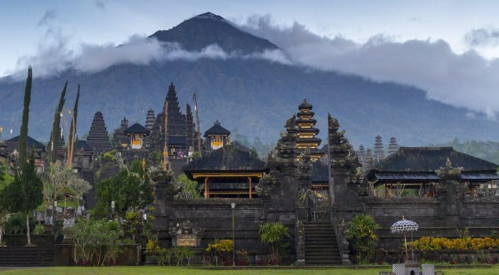 Traditional Balinese architecture at Besakih Temple surrounded by lush mountain scenery