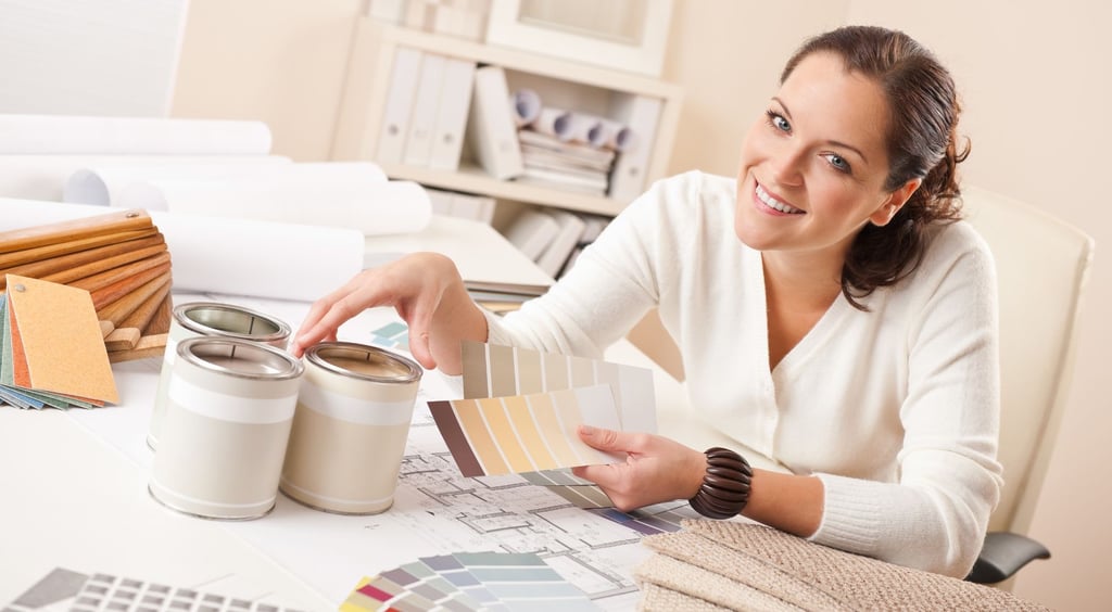 happy woman holding swatches of colors