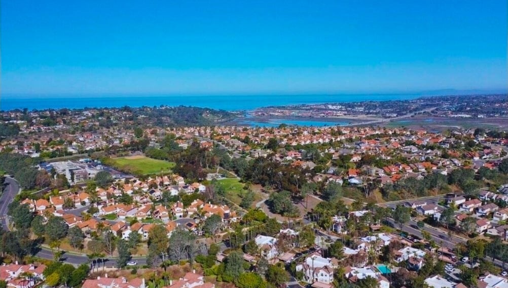 Aerial view of a coastal HOA suburban neighborhood with houses near south Carlsbad