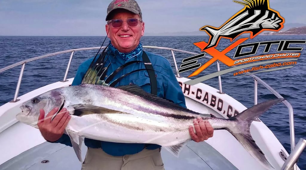 a man holding a fish on a boat
