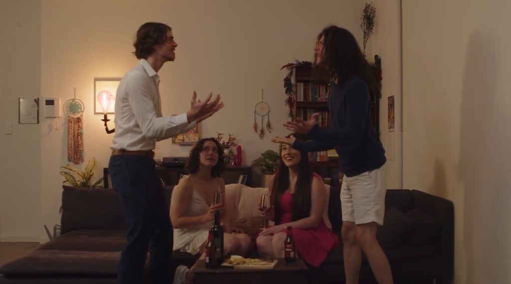 a man and woman standing in a living room