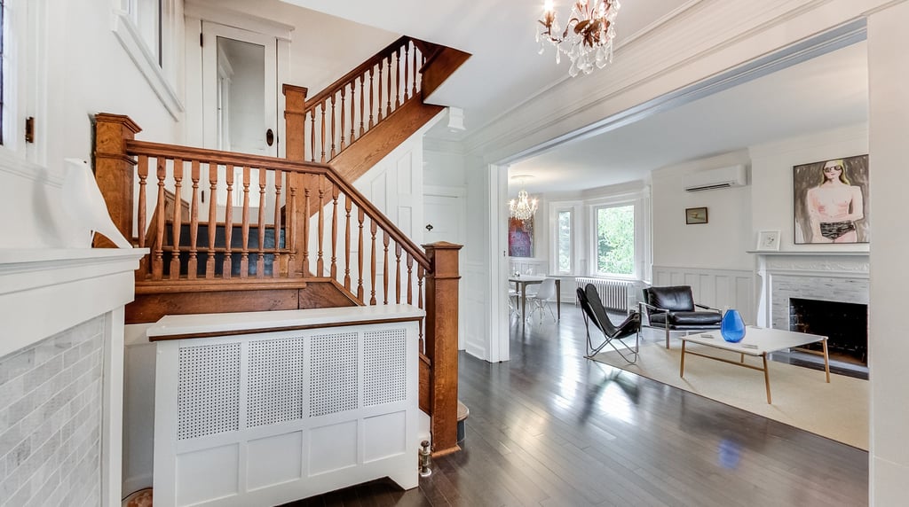 a staircase way with a chandelier and a chandelier
