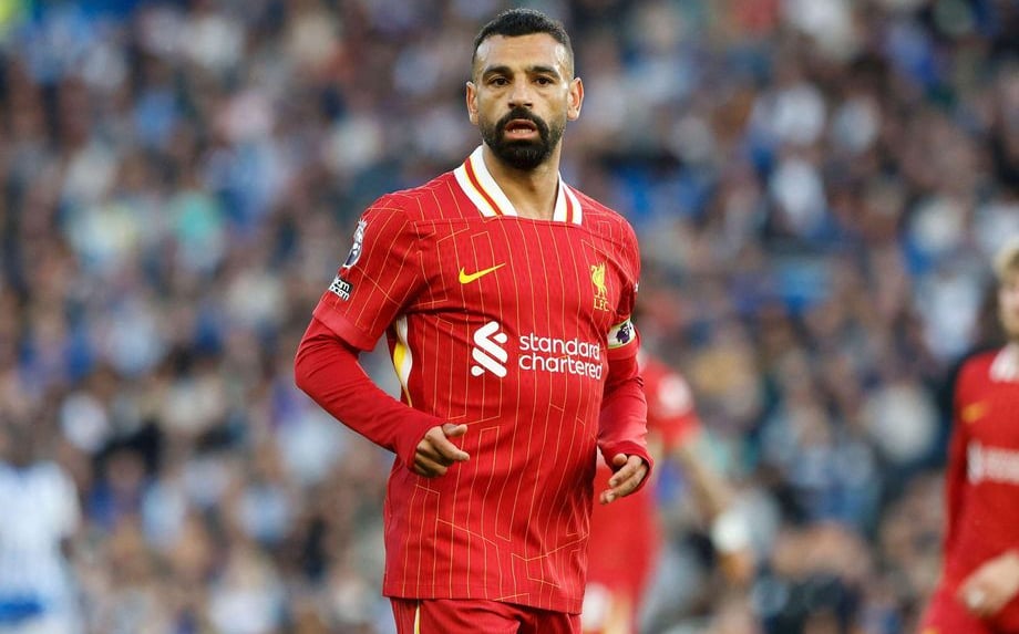 a man in a red shirt and a soccer ball