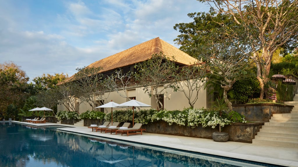 Luxury Aman Villa at Nusa Dua, Bali, featuring a private infinity pool, tropical garden, and modern Balinese architecture 