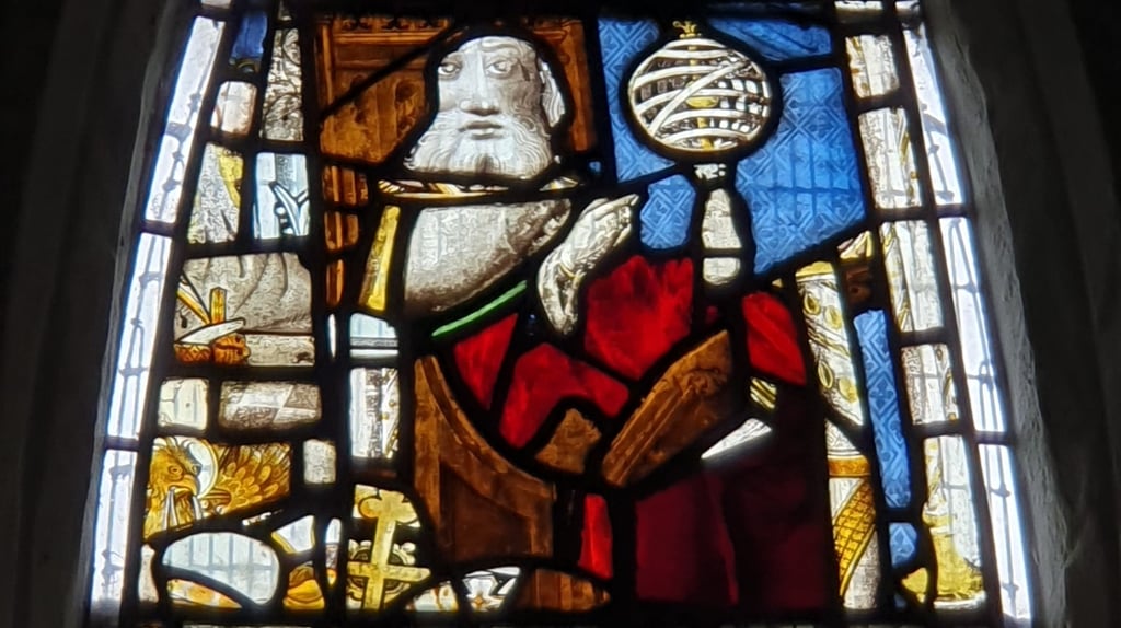 Detail of the East Window at All Saints Church, Landbeach. Figure of a magus with armillary sphere.