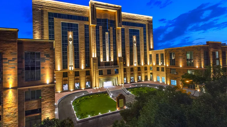 a large building with a clock tower in the middle of it