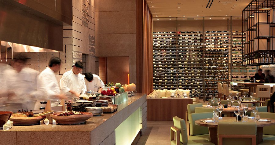 a restaurant with chefs and chefs in the background