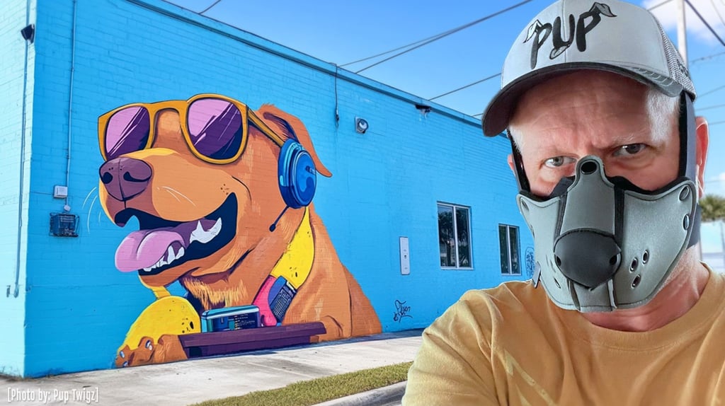 man in pup half-mask in front of a wall mural of a podcast dog
