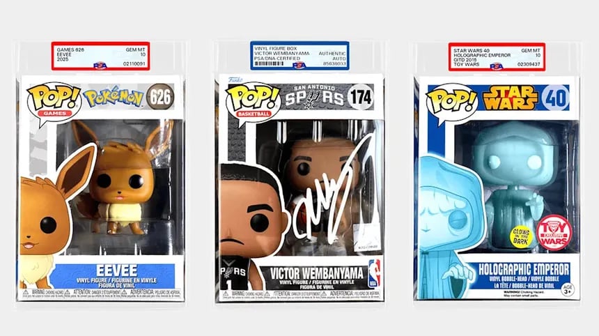 Three PSA graded Funko Pop figures featuring Eevee, Victor Wembanyama, and Holographic Emperor.