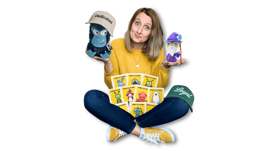 Anne Bagg holding physical Veefriends collectibles like friendscaps, plushies, trading cards, figure