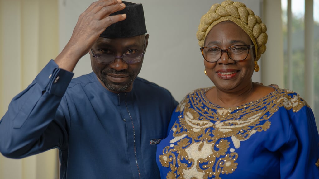 Older Nigerian couple dressed in elegant traditional attire, cultural portraits