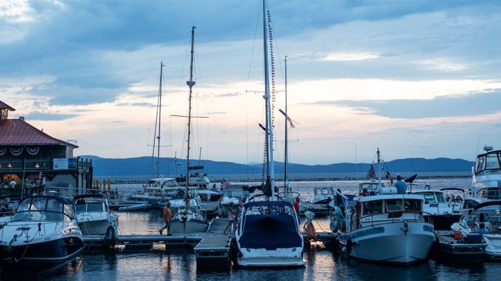 Burlington Vermont waterfront at dusk with subtle tech overlay representing local IT support
