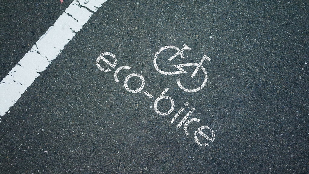 Eco-bike store spray paint on road logo mockup.