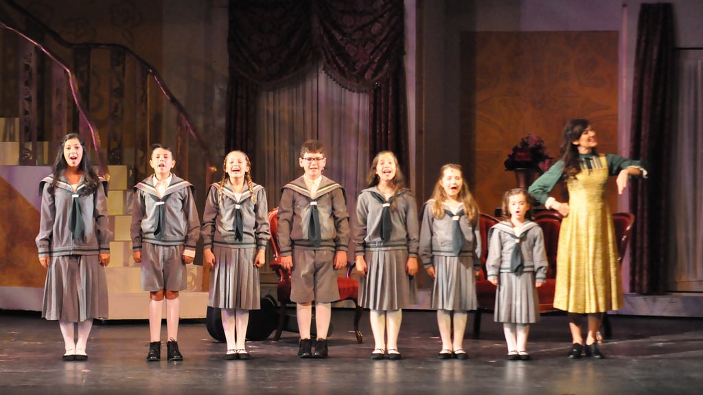 a group of people standing on a stage