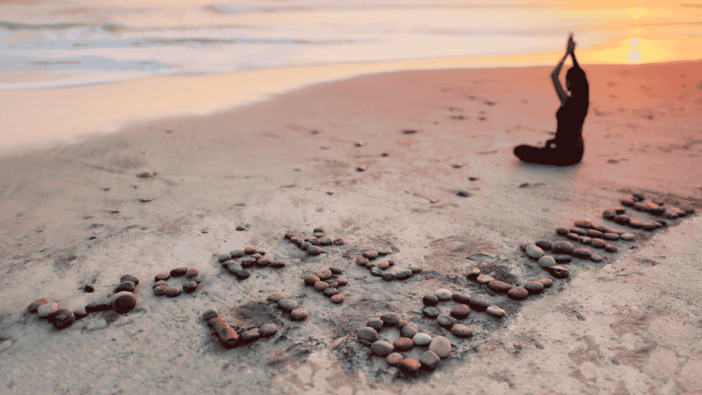 a person sitting on a beach 