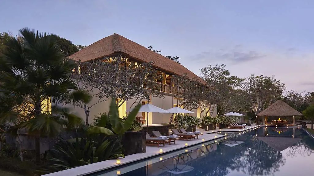 Luxury Aman Villa at Nusa Dua, Bali, featuring a private infinity pool, tropical garden, and modern Balinese architecture 