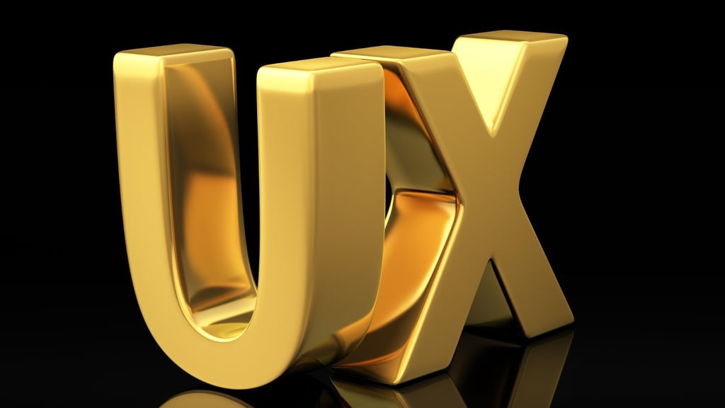 a golden letter ux on a black background