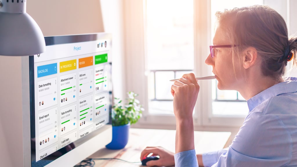 a woman sitting at a desk with a pen and a pen