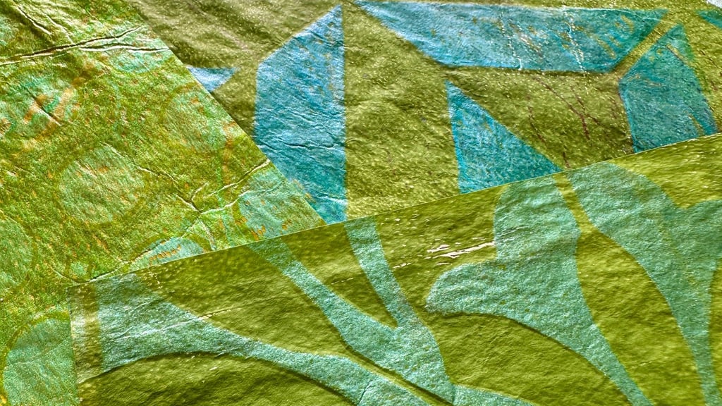 Green collage papers with bold stencil leaf pattern