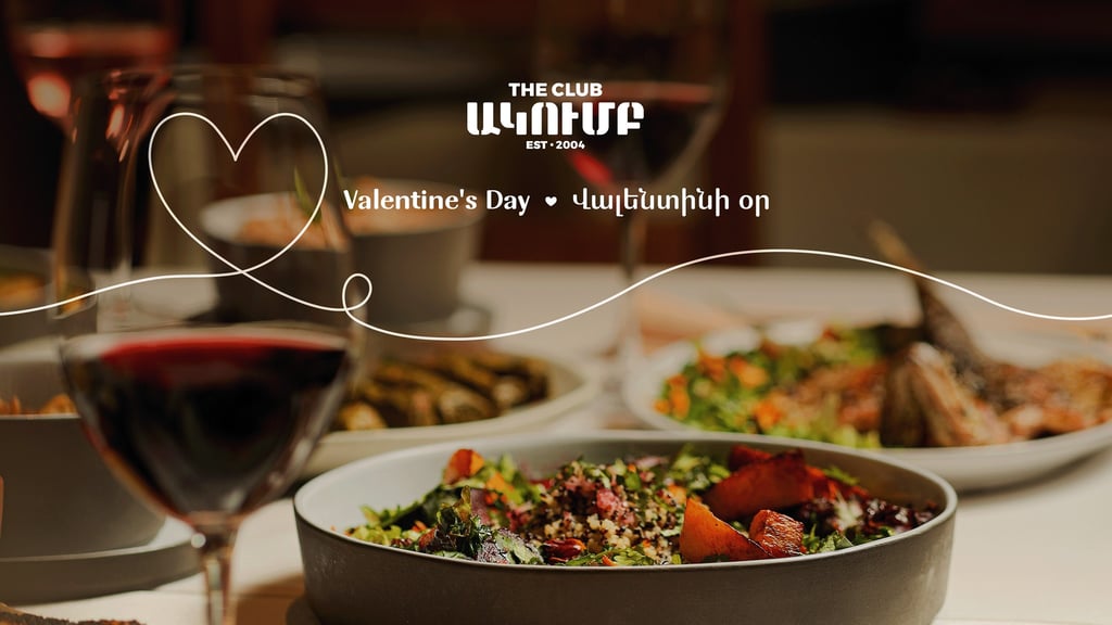 Romantic Valentine's Day dinner at The Club with gourmet salads and red wine.