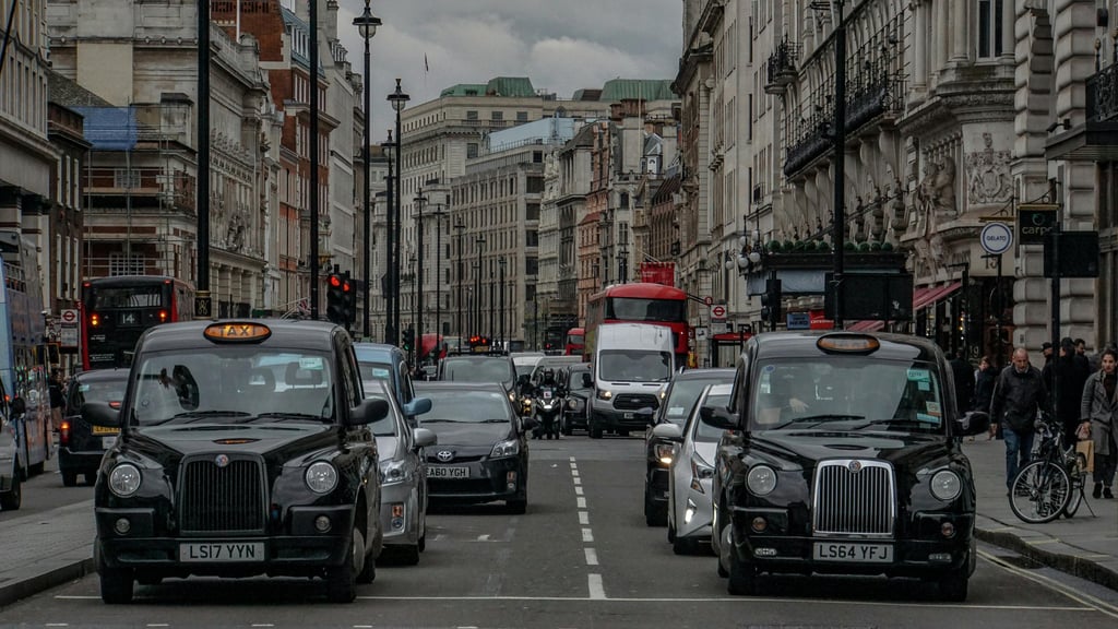 Taxis and other cars waiting in traffic