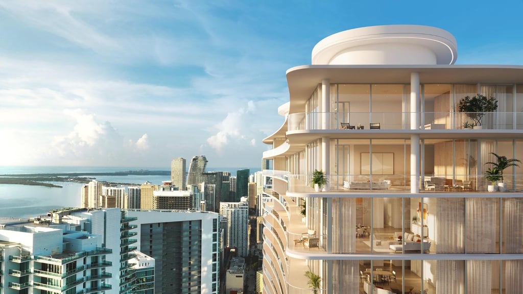 a tall building with a large balcony and a view of the ocean