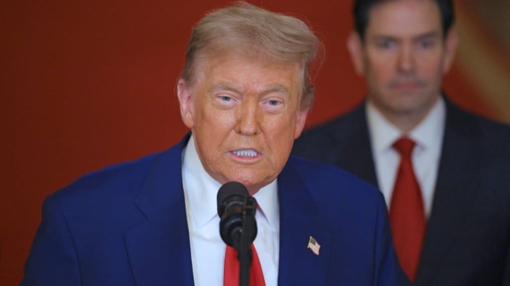 a man in a suit and tie with a microphone