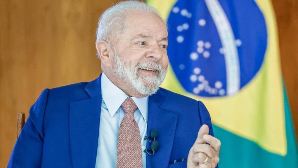 a man in a suit and tie with a flag