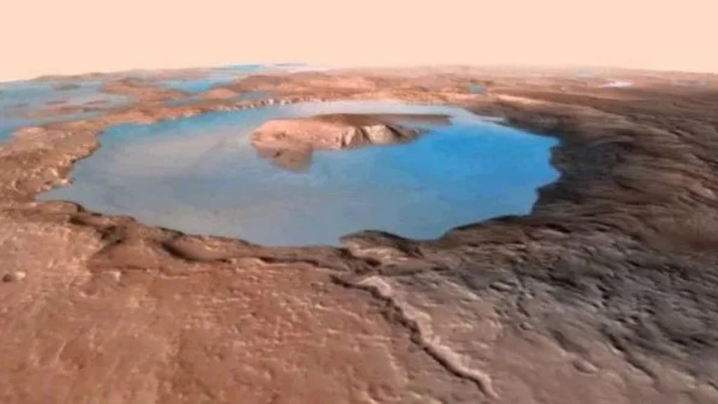 a large crater with a small pond in the middle