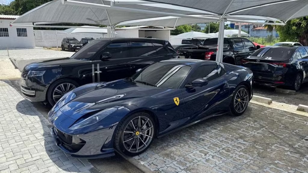 a blue ferrari car parked in a parking lot