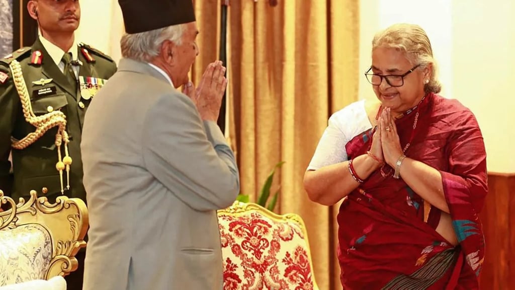 a man in a suit and a woman in a red dress