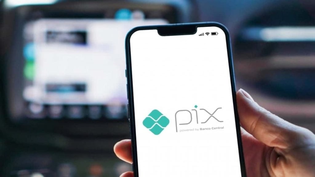 a person holding a phone with a phone in their hand