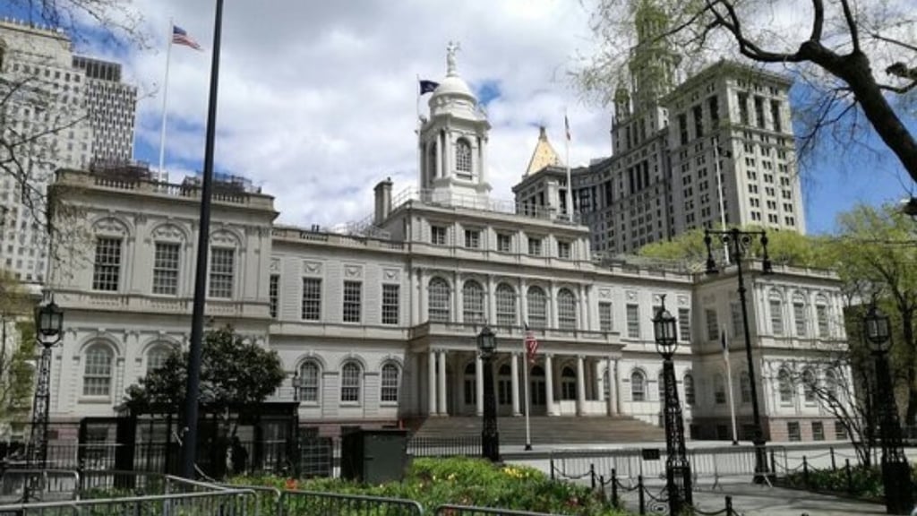 a large building with a clock tower in the middle of it