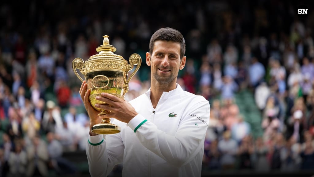 Novak Djokovic with Wimbledon trophy - a seven-time Wimbledon champion