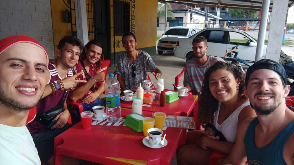 a group of people sitting at a table with drinks