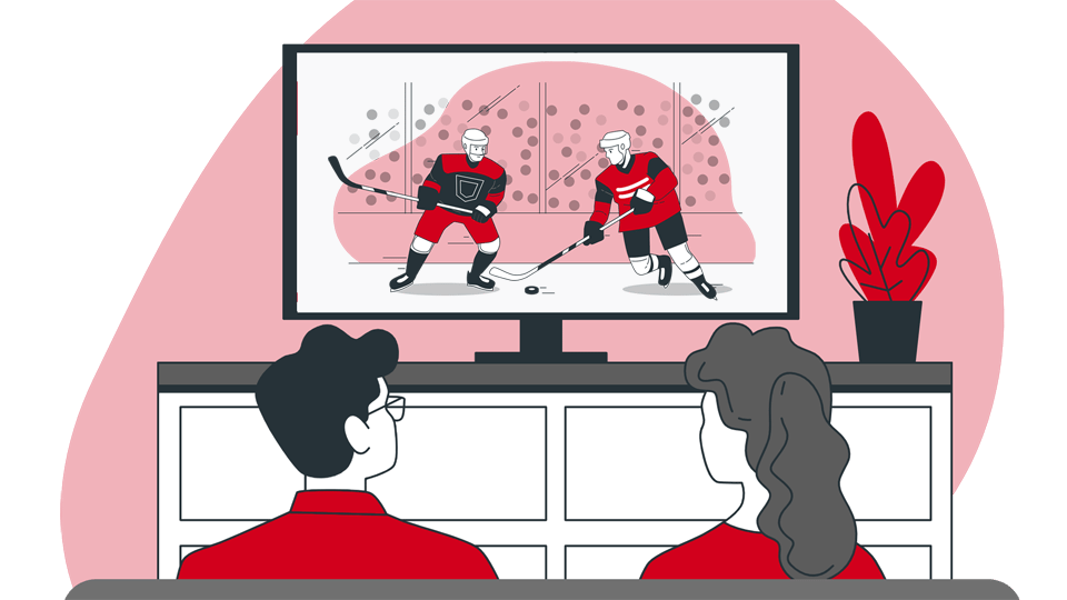 a couple sitting on a couch watching streaming sports game on their large screen TV