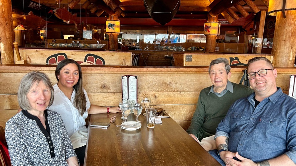 a group of people sitting at a table